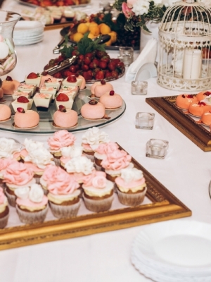 Delicious Candy,sweets,cupcakes,pops Decorated With Flowers On Table At Wedding Reception. Candy Bar